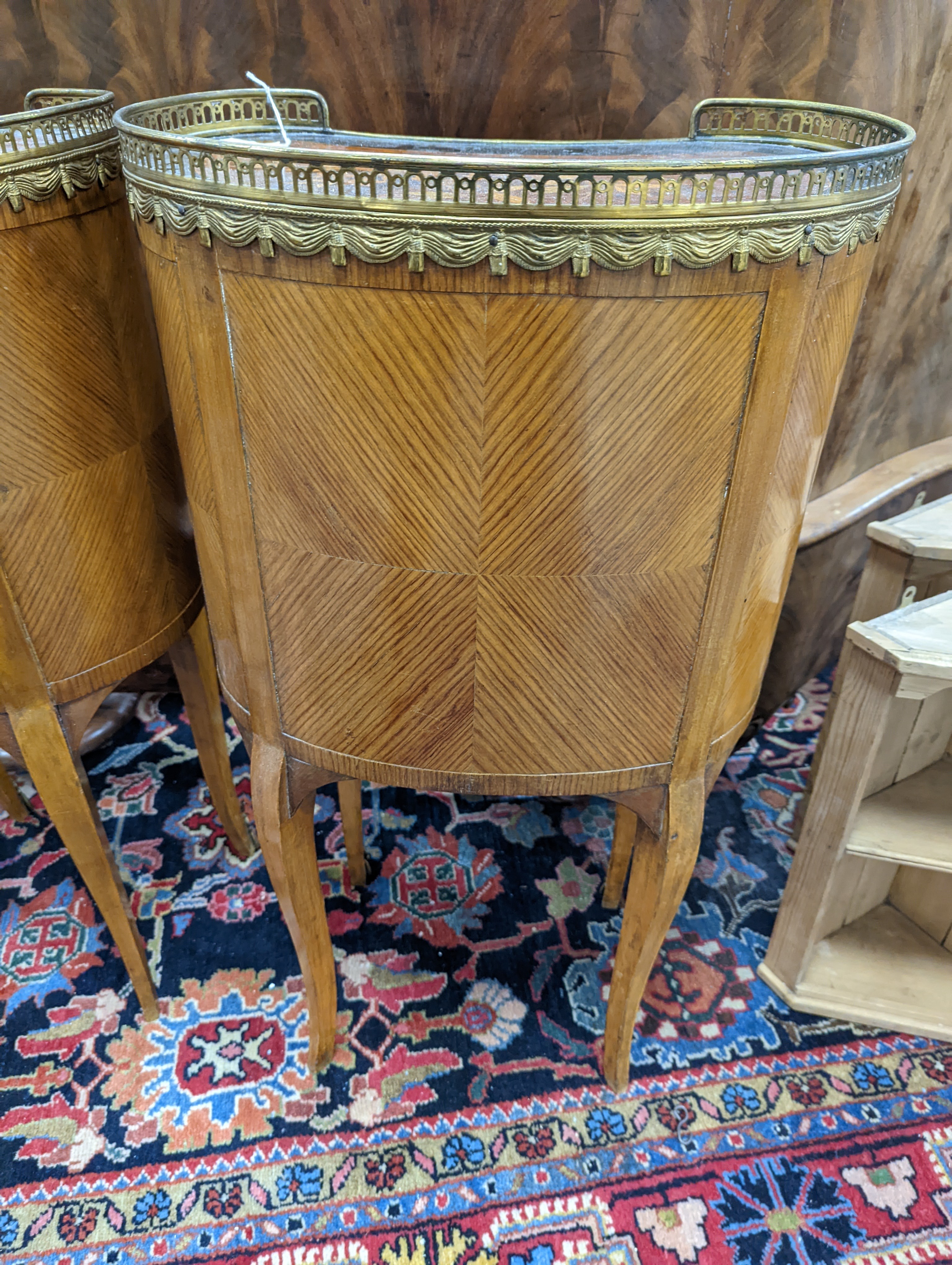 A pair of French marquetry inlaid gilt metal mounted kidney shaped two drawer bedside cabinets, width 42cm, depth 24cm, height 77cm